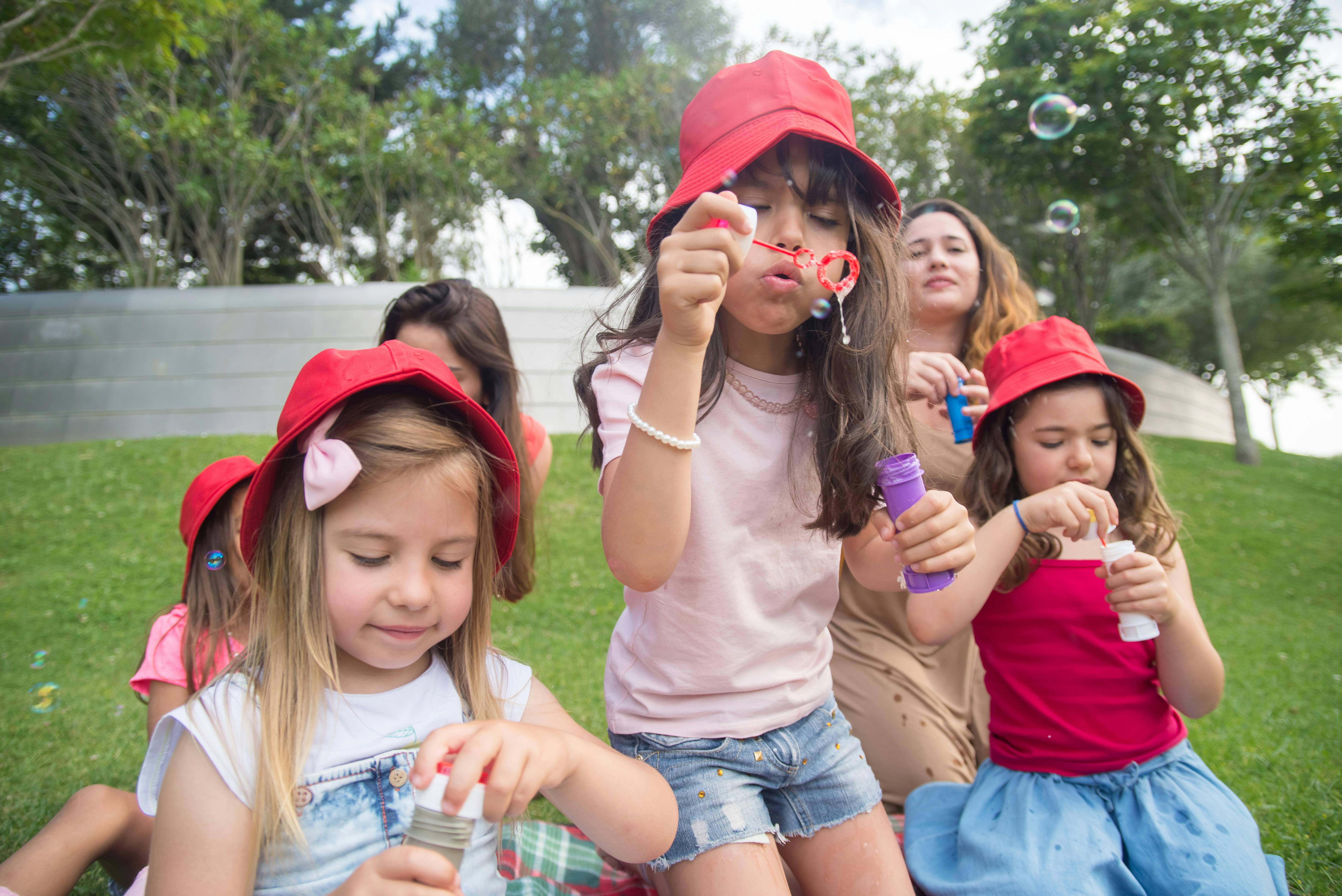 kids-blowing-bubbles-outside