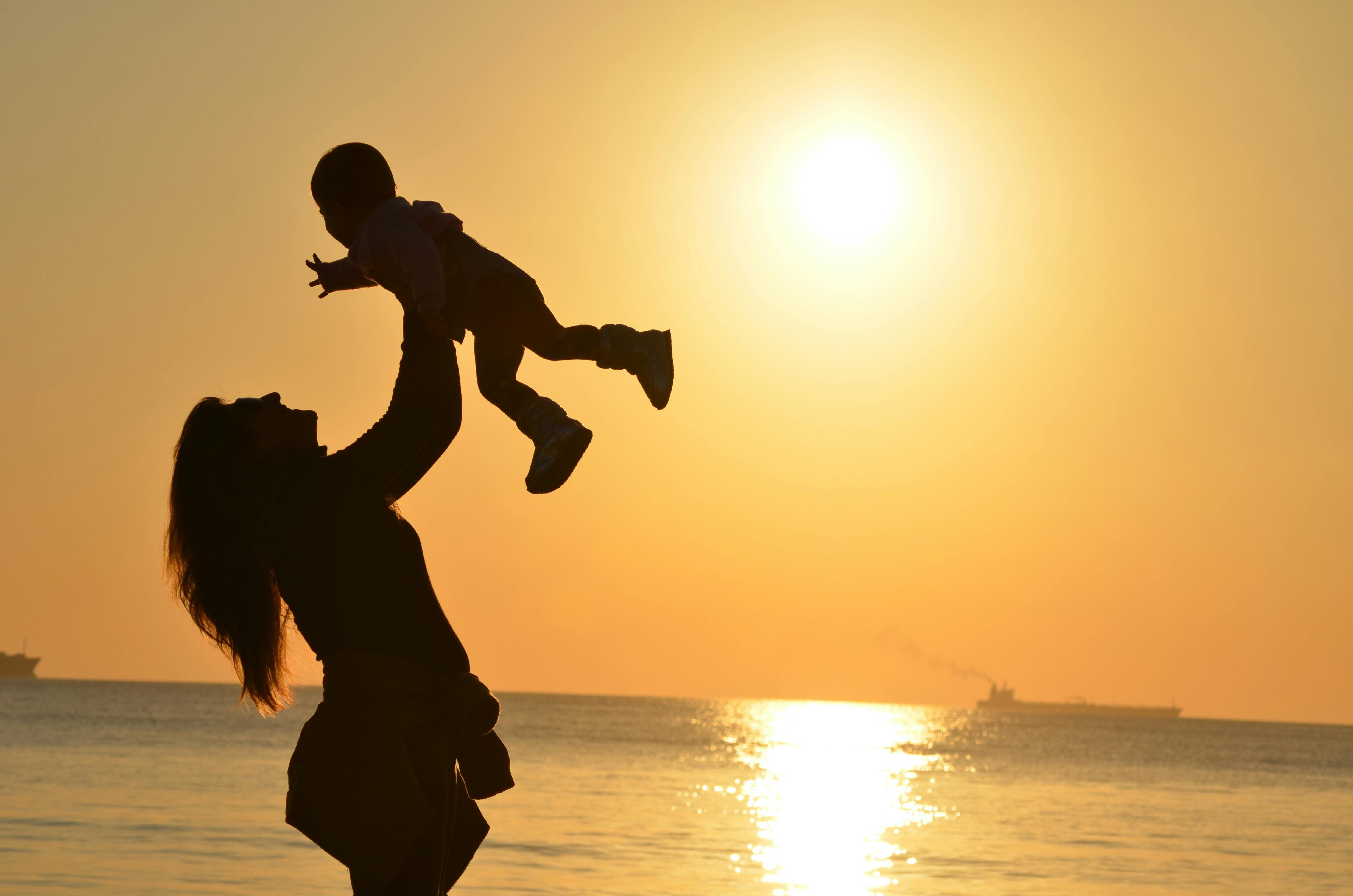 mother-lifting-child